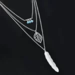 close up photo of the New Boho Turquoise Leaf Feather Layered Necklace silver edition