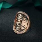 Rose Gold Ring With Filigree Tree of Life on a black background