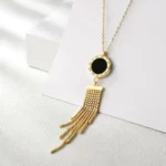 close up photo of the gold Long Tassel Pendant Necklace