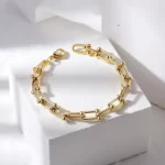 close up photo of the Fascinating Le Cheval Bracelet gold edition on a white background