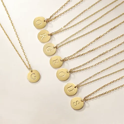 8 Gold Initial Fine Necklace creating the word gorgeous