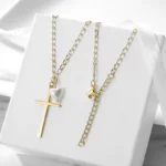 the Golden Cross With Pearl Pendant Necklace on a white gift box