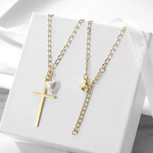 the Golden Cross With Pearl Pendant Necklace on a white gift box