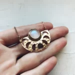 the Stunning Hand-Made Necklace Of The Moon on a hand