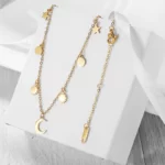 the Stunning Golden Celestial Necklace on a white gift box