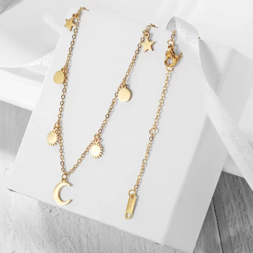 the Stunning Golden Celestial Necklace on a white gift box