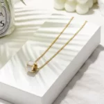 the gold plated Stunning Round CZ Pendant Necklace on a white gift box