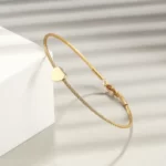 close up photo of the Golden Heart Cable Bangle Bracelet