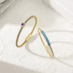 the two bangles of the Astonishing Golden Gemstone CZ Halo Bangle Set