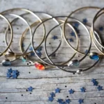 the Fascinating Solar System Stacked Bangle Set on a wooden surface