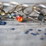 close up photo of the Fascinating Solar System Stacked Bangle Set on a wooden surface