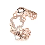 the rose gold edition of the Seductive Hollow Clover Wide Cuff Bracelet