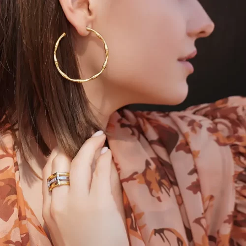 a woman wearing the Amazing Golden Bamboo Earhoops