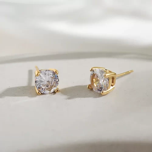 the Awesome Basket-Set Round CZ Stud Earrings on a white surface