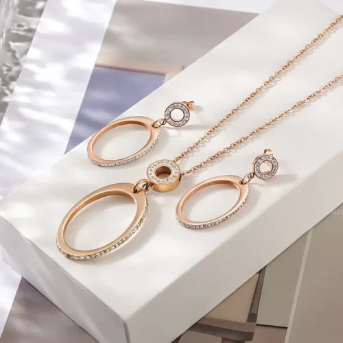 the Rose Gold Oval Pendant Set With CZ on a white gift box