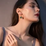 a woman wearing the Sexy Layered Discs Drop Earrings