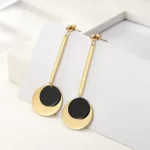 the Spectacular Gold Black Discs Dangle Earrings on a white background