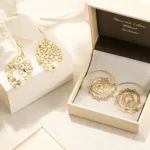 the Unique Vintage Circle Round Spiral Earrings inside a jewelry box