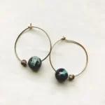 the Cosmic Hoop Earrings With Jasper Beads in gold tone