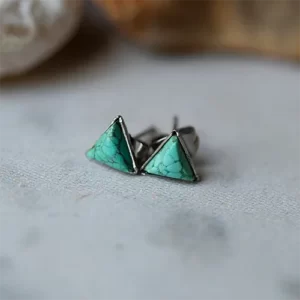 close up photo of the Tiny Triangle Turquoise Stud Earrings