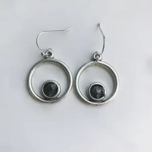 close up photo of the Circle Silver Earrings With Raw Meteorite