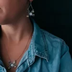 a woman wearing the Jupiter and Galilean Moons Dangle Earrings